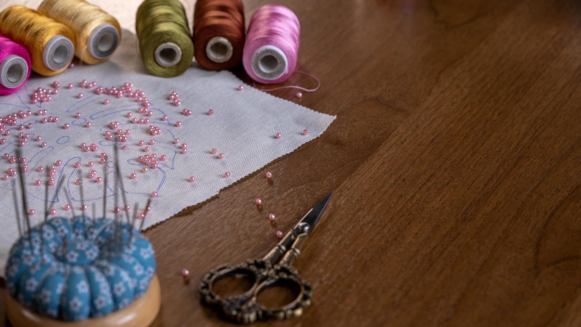 atelier workspace with embroidery machine and threads