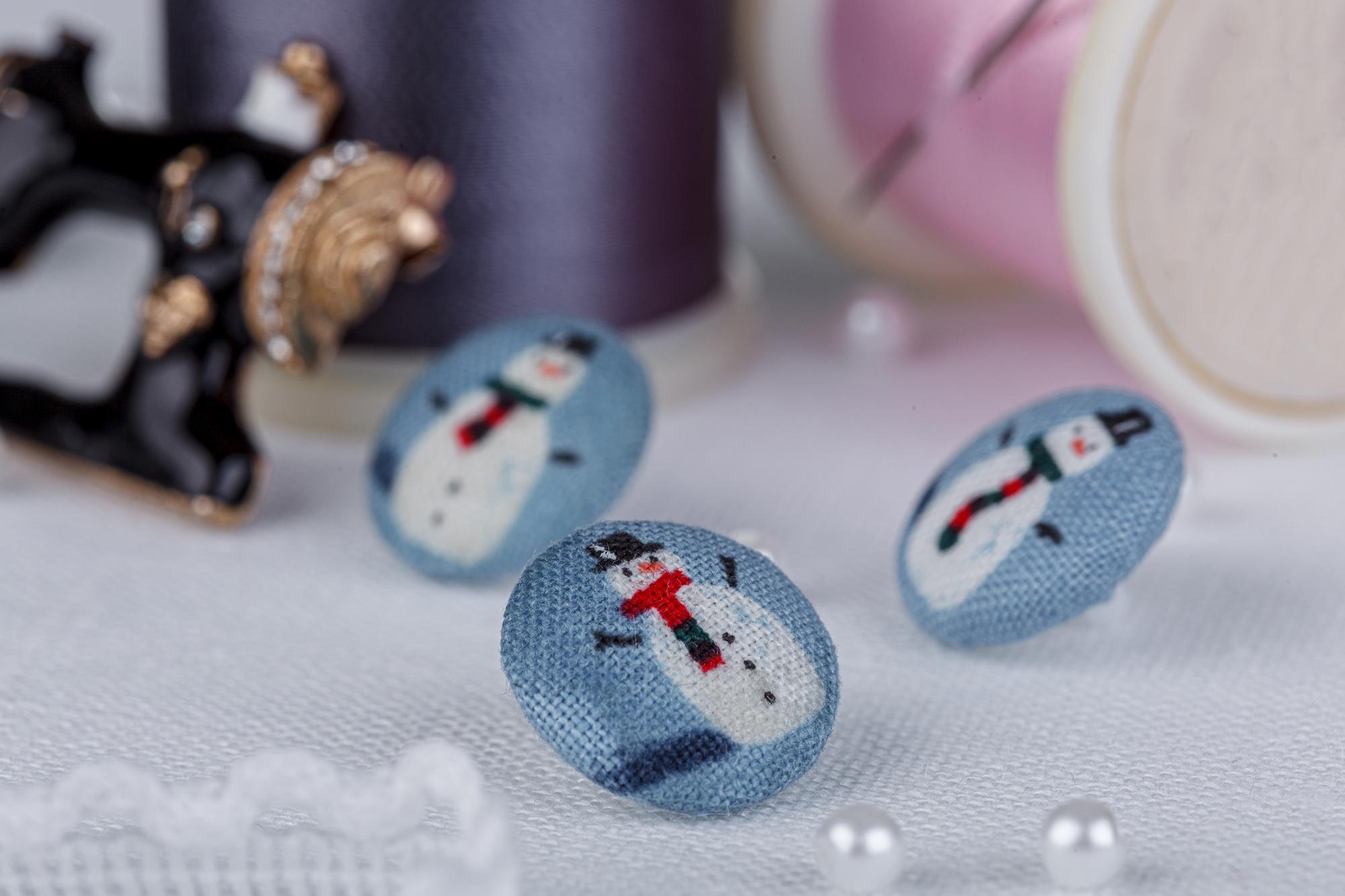 assortment of embroidered badges on table